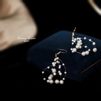 China CLASSIC Hand & Beaded Shell Pearl Women's Stunning Long Style Fairy Earrings Woven Earrings Beaded Tassel Earrings for sale