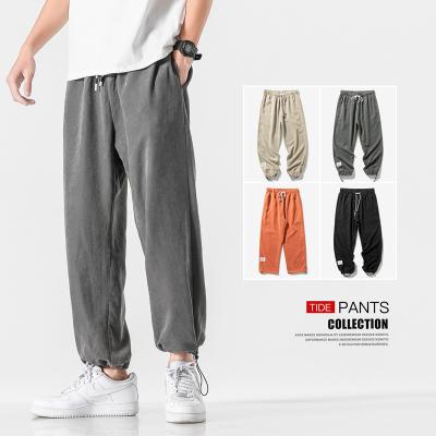 China Anti-wrinkle trend suede men's casual jogger pants pants beam loose sports pants with strings for sale