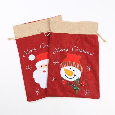 China Hot Selling Cloth Candy Christmas Drawstring Gift Bag Canvas Light Up Christmas Gift Bags for sale