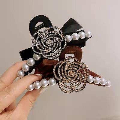 China No bowknot luxury crystal velor women pearl flower rhinestone designer brand designer brand hair clip plastic claw for sale