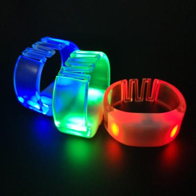 China ABS case+PVC bands+electric elements wireless radio controlled RF light up LED flashing wristbands for events DMX LED wristbands for sale