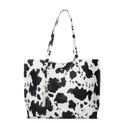 China Vintage Cow Printing Large Soft Tassel Leather Women Shopping Handbags Faux Cross - Shoulder Foldable Body Totes Tote Bag for sale