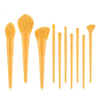 China Angular Blush 10pcs Makeup Brushes Yellow Handle Makeup Tools Wooden Eye Brush Set for sale