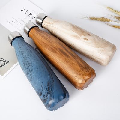 China Texture Printing Cola Shape Double Wall Sustainable Wooden Vacuum Insulated Water Bottle for sale