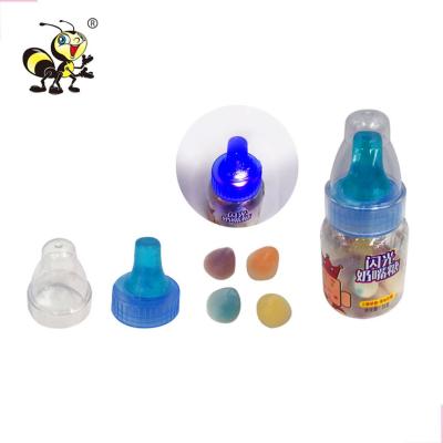 China Cartoon Toys Cartoon Toys Popping Nipple Ring Hard Halal With Light Baby Bottle Jumping Toy Candy for sale