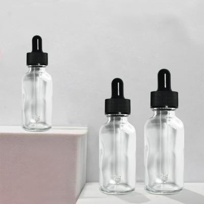 China Cosmetic 1oz/30ml 2oz/60ml 4oz/120ml Boston Serum Packaging Round Clear Glass Bottle With Glass Dropper For Essential Oils for sale