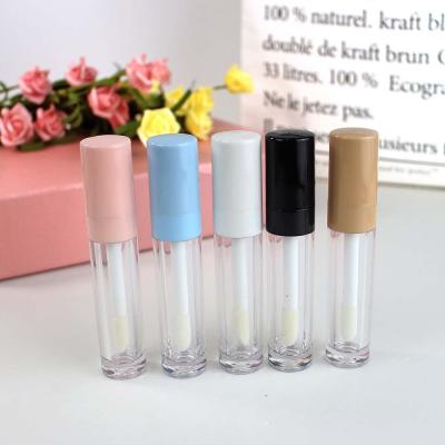 China Cosmetic Round 8ml Stock Yellow Blue Pink Lip Balm Lip Gloss Black White Tube With Big Wand Lip Gloss Container Tube for sale