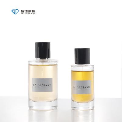 China Cosmetic BAIDE Luxury clear cylindrical 50ml glass perfume bottle 100ml with packing box for sale