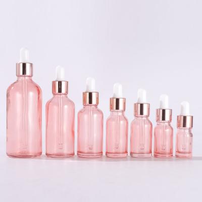 China Cosmetic 5ml 10ml 15ml 20ml 30ml 50ml 100ml pink roller glass bottles for essential oils for sale