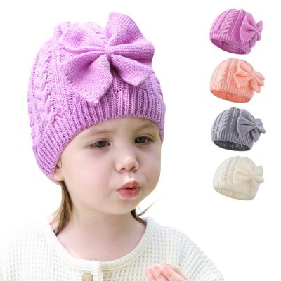 China Wholesale Picture Winter Solid Color Dome Twist Thermal Cap Bow Knit Wool Baby Hat For Kids for sale