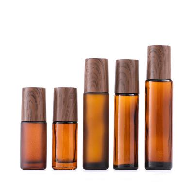 China Wholesale 10ml Amber Blue Empty Essential Oil Cosmetic Clear Bottle Lip Gloss Roller Tube Glass Roll On Bottles With Metal Trackball for sale