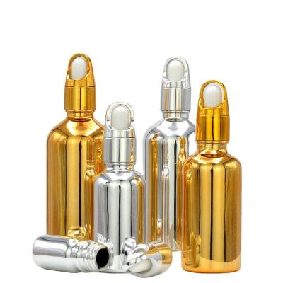 China New arrival cosmetic 10ml 15ml 20ml 30ml 50ml 100ml plate essential oil gold silver glass serum cosmetic bottle for sale