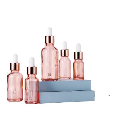 China Cheap cosmetic 5ml10ml 15ml 30ml 50ml 100ml rose gold essential oil glass bottle for sale