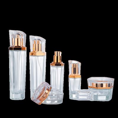 China Luxury Clear Hexagonal Chic Cosmetic Glass Bottle Jar Set Cosmetics Containers And Luxury Packaging Skin Cream Lotion Bottles for sale