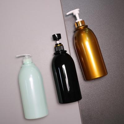 China 750ml Shower Gel Plastic Packaging Bottle Black Gold Cosmetic Lotion Pump Bottles 750ml Shampoo Bottle for sale