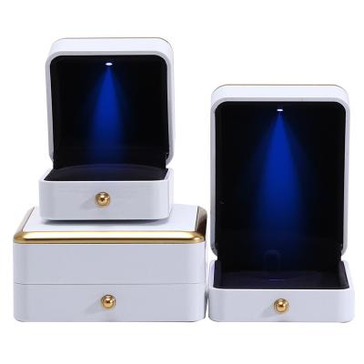 China Custom Jewellery Box Packaging Gold Trim Plastic Jewelry Case With LED Lighting for sale