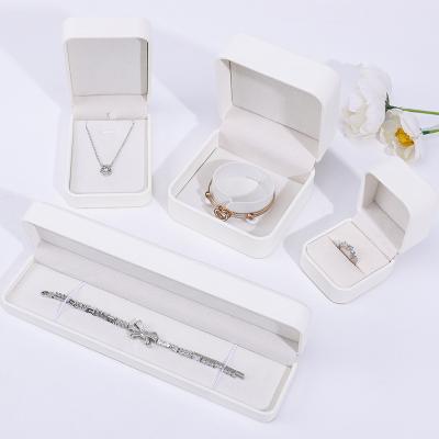 China Plain White PU Leather Jewelry Box , Leather Jewelry Case For Ring Pendant Bracelet for sale