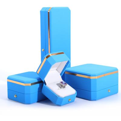 China Blue PU Leather Gift Wrap Jewelry Box for Hanhong Octagonal Metal Button Custom Logo for sale