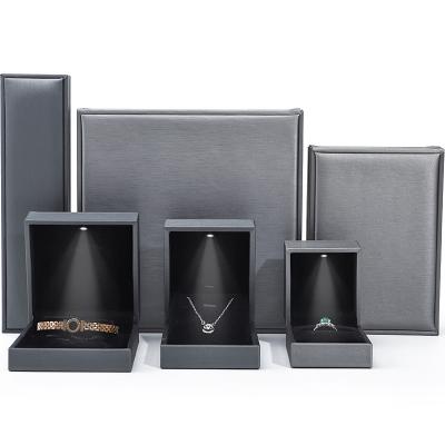 China Grey Lightweight Leather LED Jewelry Box Luxury Packaging For Bracelet Necklace Ring for sale