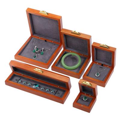 China Custom Embossing Logo Luxury Wood Jewelry Box Packaging For Bracelet Necklace Set for sale