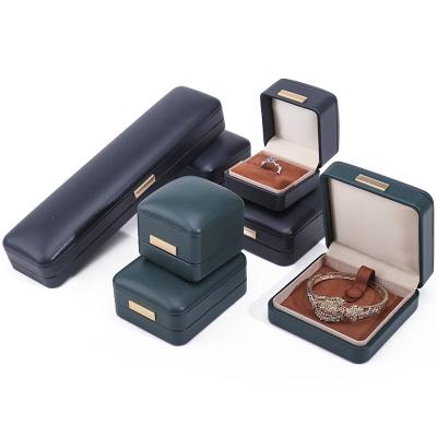 China Handy Convex Roof Faux Leather Luxury Jewelry Box Package with Gold Bar Ornament for sale