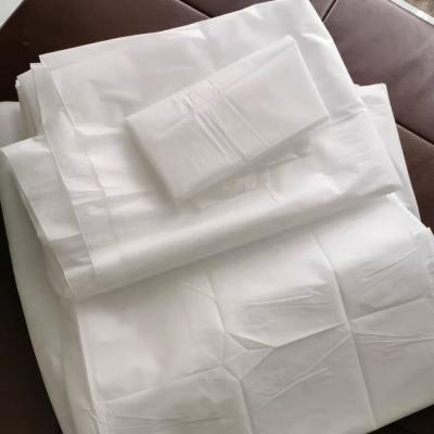 China Bed Comforter Set Sheet And Pillow Cover Anti-static Disposable White Nonwoven Bed Linen for sale