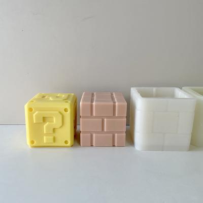 China The Square Cube Candle In New Design Soybean Disposable Wax Mold Handmade Decoration Mario Block Silicone Candle Mold for sale