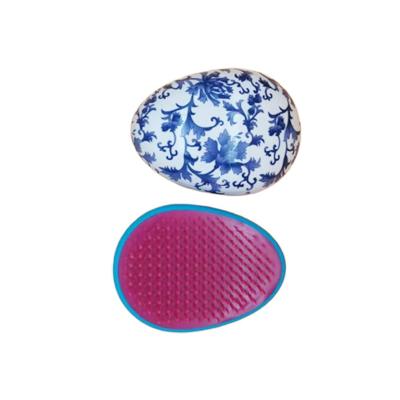 China Egg Shape Waterproof Detangle Plastic Hair Brush for sale