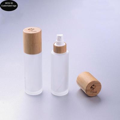 China 50ml Frosted Glass Lotion Bottle With 20 Caliber Powder Pump Spray Bottled Bamboo Full Cover Cosmetic Packaging Te koop