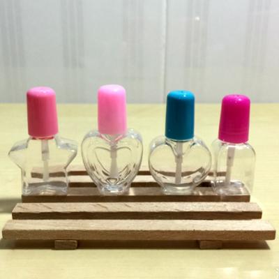 중국 5ml Transparent Plastic Empty Nail Polished Bottle With many shape Brush Plastic Nail Bottle and many color for the cap 판매용