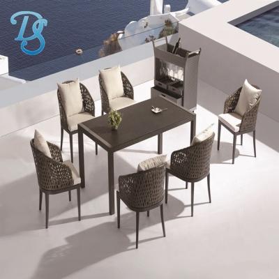 China Leisure PE Rattan Chair and Jet-stone Glass Dining Table Sets for sale