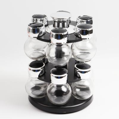 China 12 viable jars 2 floor rotating spice sprice standing rack organizer glass jar with metalize plastic liner cover for sale