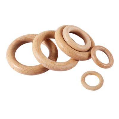 China Modern Simple Ring Shaped Circle Magnet Adsorption Scarf Hanger Wooden Beech Wood Ladies Clothing Store for sale