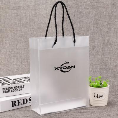 China XYDAN BAG Handled Spot Frosted Transparent Plastic PP Handbag Clothes Gift Bag Custom Printed PVC Shopping Bag 100% ECO for sale