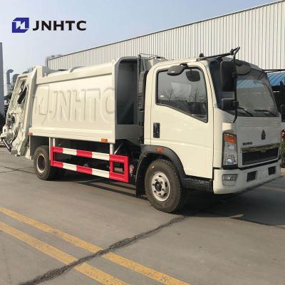 China Construction Material Stores SINOTRUK HOWO 4x2 Small Rear Loader Garbage Truck Manufacturers Garbage Truck for sale