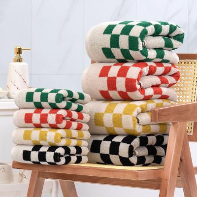 China 2022 New Chessboard Pattern Compressed Household Wrapping Towels Soft Water Absorbent Suit Bath Towels for sale