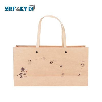 China Customized Wholesale Disposable Brown Kraft Paper Packaging Shopping Bag With Handles for sale