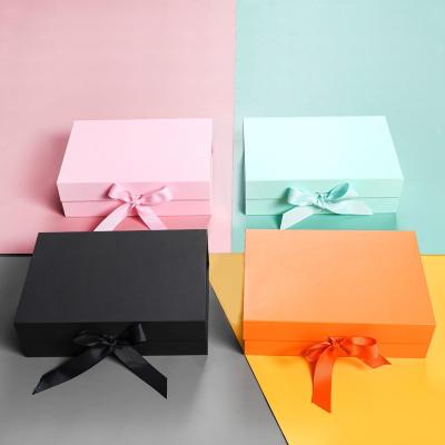 China Low MOQ Large Custom Luxury Black Pink Folding Recycled Materials Sets Foldable Gift Box With Magnets Ribbon Folding Cardboard Box For Apparel for sale