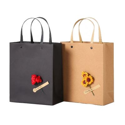 China Custom Recycled Materials Decal Kraft Paper Gift Bag Clothing Packaging Bag Shopping Gift Bag Handbag With Handle for sale