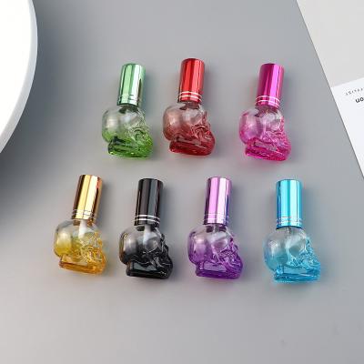 China New Design Sustainable/Eco-friendly/Stocked Colorful Skull Shape 8ML Mini Perfumes Bottle Glass Empty Spray Glass Refillable Perfume Bottle for sale