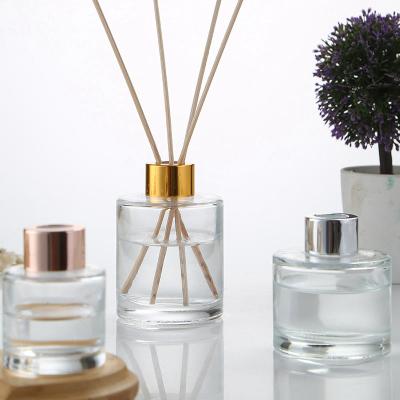 China Hot Sale Viable/Eco-Friendly/Stocked Clear Round Reed Aroma Glass Bottle Oil Bottle Aroma Diffuser Glass Bottle Cylinder Perfume Bottle With Screw Cap/Cork for sale