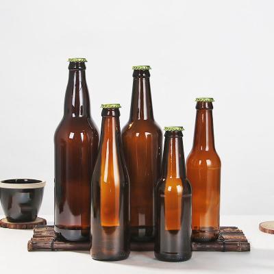 China 250ml 330ml 500ml 650ml Empty Stocked Amber Glass Beer Bottle Liquid Beverage Drinking Bottle Viable/Eco-friendly/Stocked Glass Drinking Bottle With Metal Lids for sale