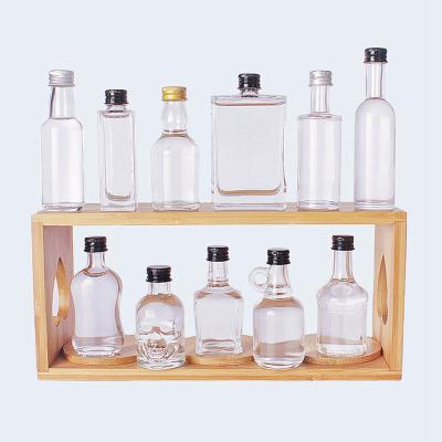 China Viable/Eco-friendly/Stocked Clear Empty Glass Wine Bottle Brandy Whiskey Glass Bottle 20ml 35ml 50ml 100ml Various Design Spirits Wine Vodka Wholesale Small for sale