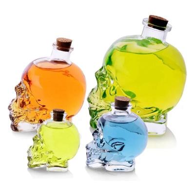 China Wholesale Viable/Eco-friendly/Stocked Skull Skeleton Shape Glass Bottle For Dordeaux Wine Ice Beverage Skull Glass Wine Water Bottle For Sale With Cork for sale