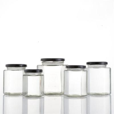 China Viable/Stored Hexagonal Honey Bottle Jam Spice Glass Jar Caviar Bottles Pickle Bottle Food Storage Jar With Metal Lid for sale