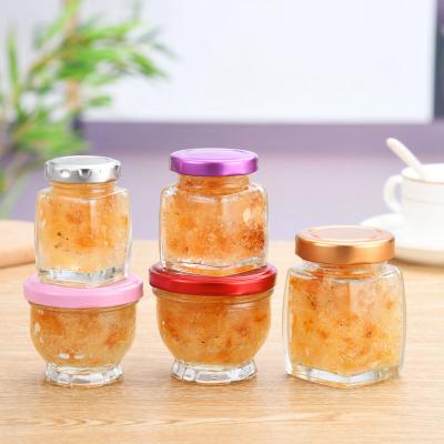 China Viable/Stored Honey Packing Bee Jam Jar Food Glass Storage Bottles 50ml 75ml 100ml Lotus Shape Mini Glass Honey Bulk Jar With Lids for sale