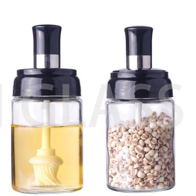 China Stocked Clear Salt Bottles Glass Shaker Bottle Jam Spice Jar Seasoning Container With Spoon Brush for sale