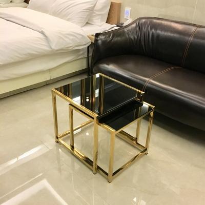 China Stainless steel design coffea table stable glass top hotel nested tea table for living room for sale