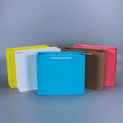 China Recyclable cheap candy gift mini gift paper carrier bag of kraft paper bag material china for sale