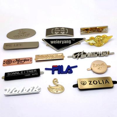 China Viable Newest Design Custom Garment Metal Brand Logo Metal Clothing Tags Decorative Bag Metal Tag Label for sale